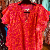 Pink and orange print top in plus sizes from Umgee