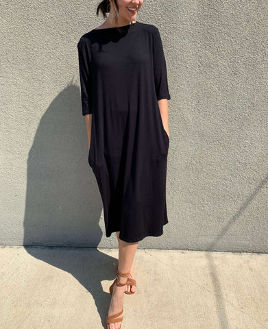 black t-shirt dress with square neck and long sleeves