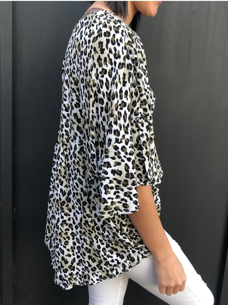 leopard blouse with ruffle detail in our boutique