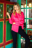 pink satin top in our boutique