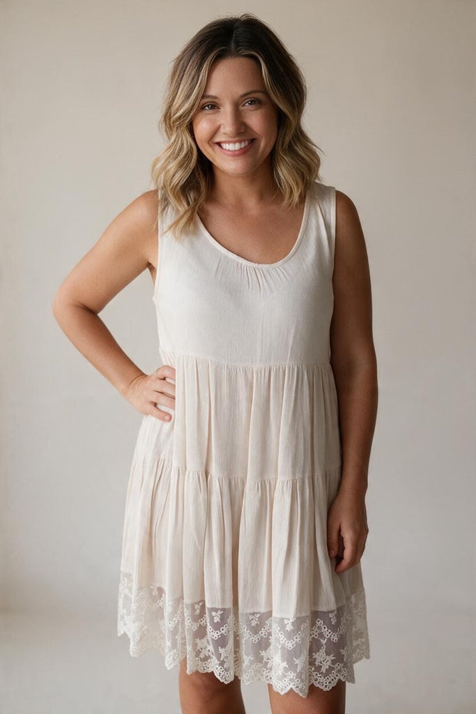 beige sleeveless with lace hem, and tiers