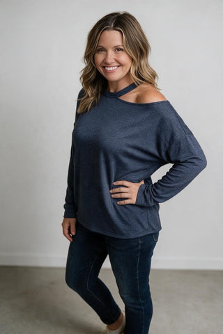 blue top with cut neck detail, off the shoulder
