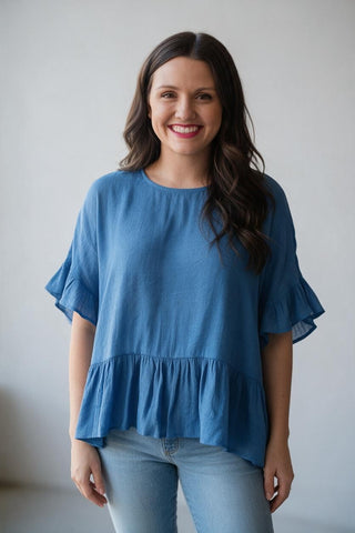 blue babydol top with rufle sleeves and hem
