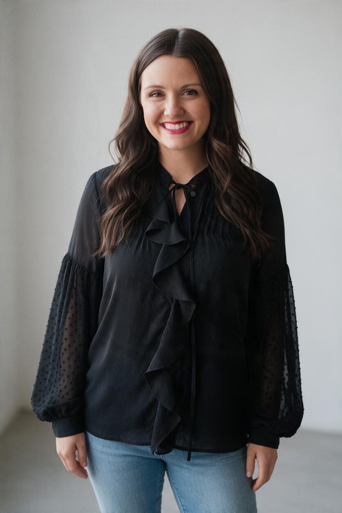 black blouse with ruffles and statement sleeves
