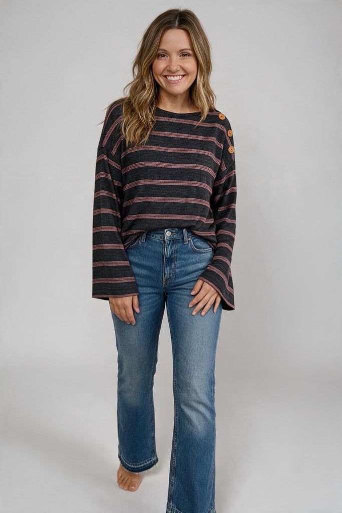 black and red striped top with button detail and statement sleeves