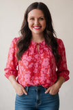 pink floral blouse