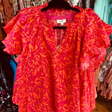 Pink and orange print top in plus sizes from Umgee