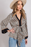 tan and black print neutral blouse