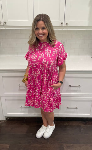 pink floral print knit dress with side pockets in our boutique aunt lillie bells