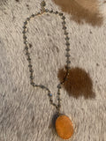 western beaded necklace with a pumpkin orange stone in our boutique aunt lillie bells