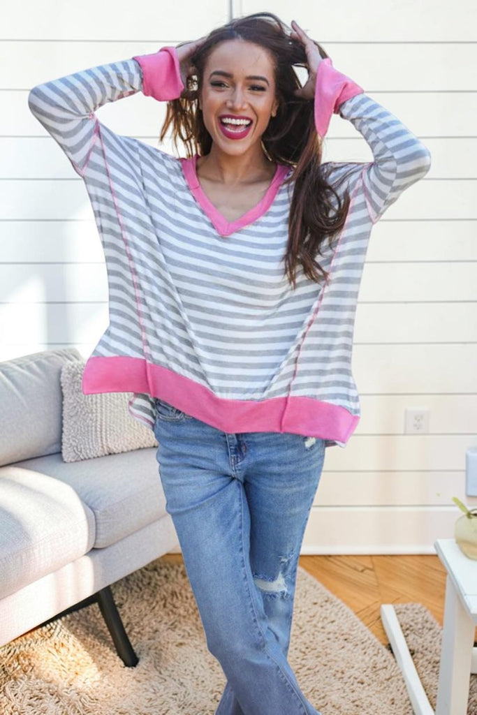 grey and white striped top with pink trim
