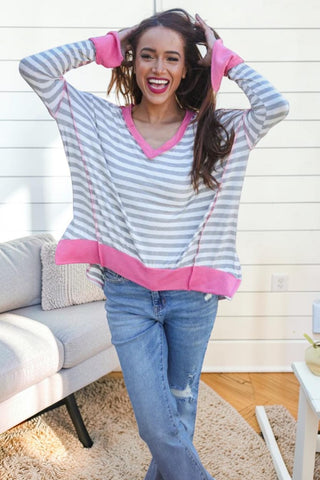 grey and white striped top with pink trim