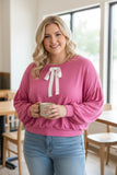 pink top with white bow in plus sizes