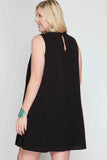 Black plus size dress with a keyhole neckline and it is sleeveless