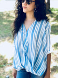 Blue and white striped top with a twist front 