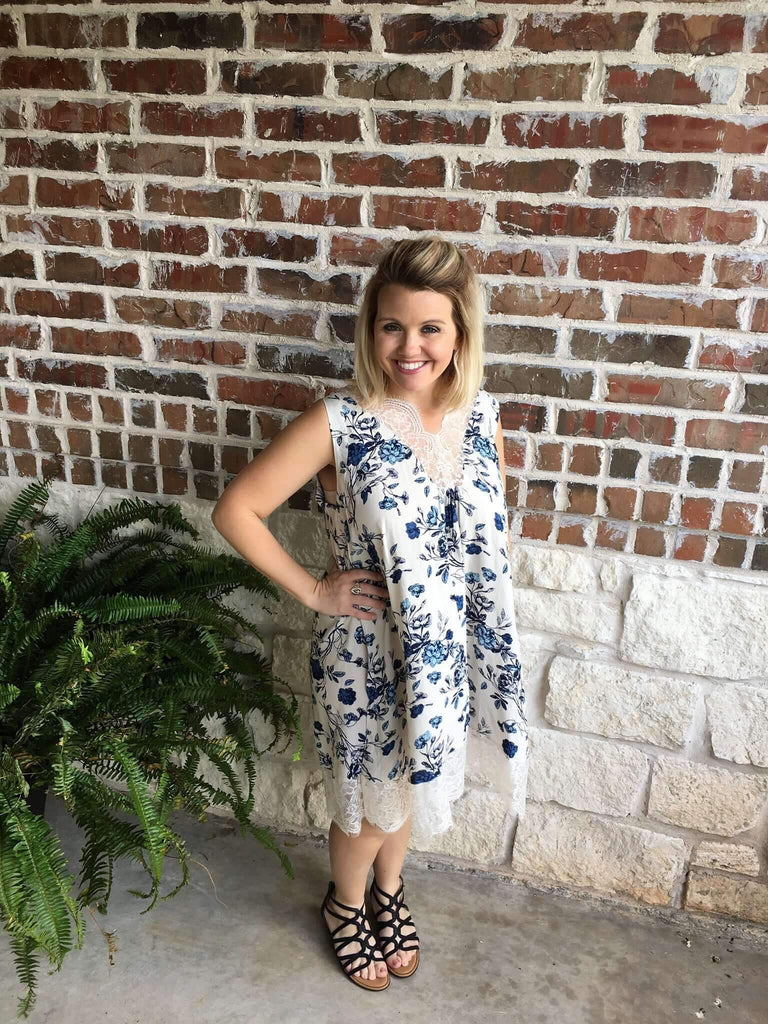 Cream and Navy floral print dress with lace trim at the neck