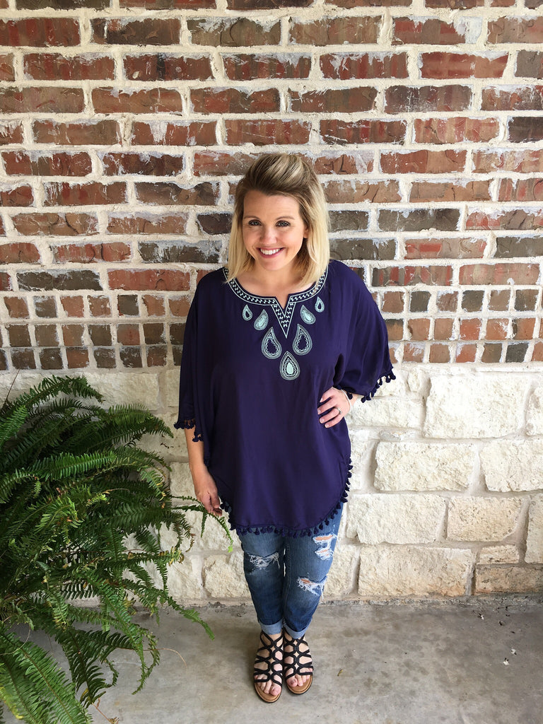 Navy Embroidered Poncho Top that is perfect for vacation and resort wear in our boutique aunt lillie bells