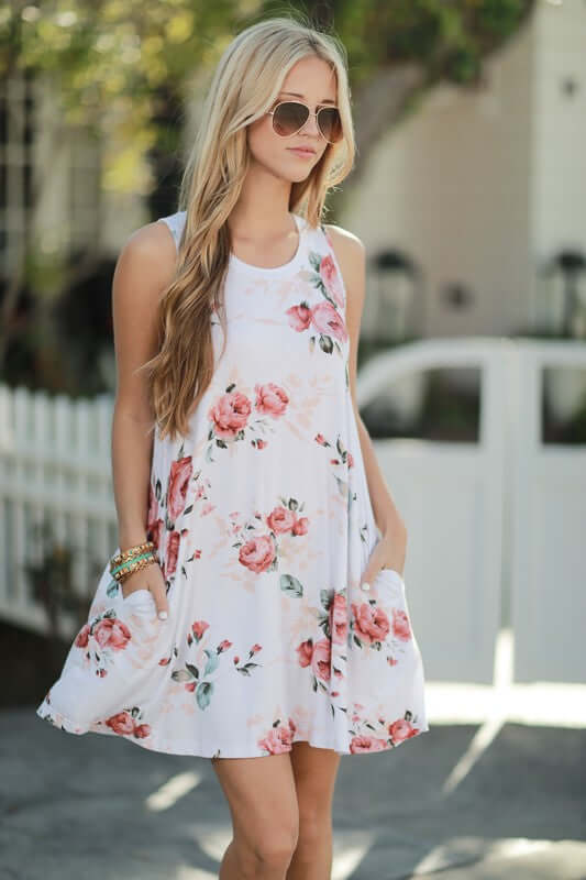 white dress with floral print, sleeveless and perfect for summer