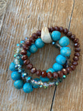 Turquoise and brown wood and glass beads in this boho inspired bracelet