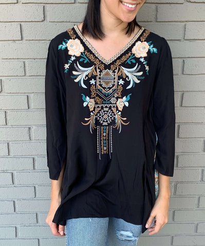 black top with blue embroidery front and paisley print back detail in our boutique Aunt Lillie Bells