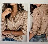 taupe top with gold dots, sure to be a statement top
