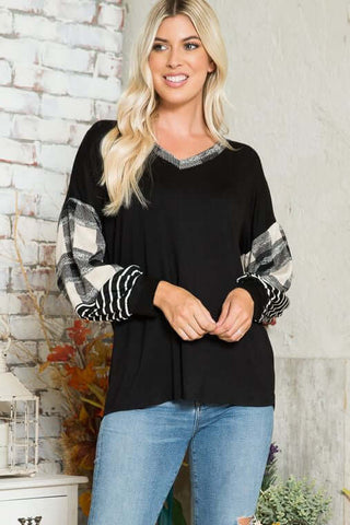 black top with white and black plaid sleeves in plus sizes in our boutique aunt lillie bells